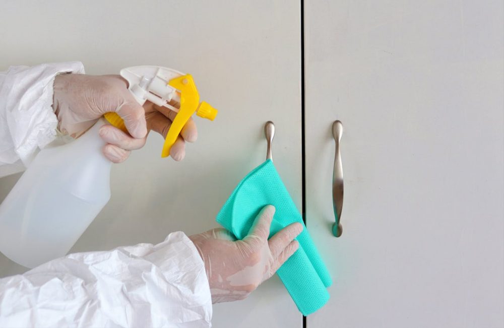 Cleaning kitchen cabinets before painting to remove grease and residue